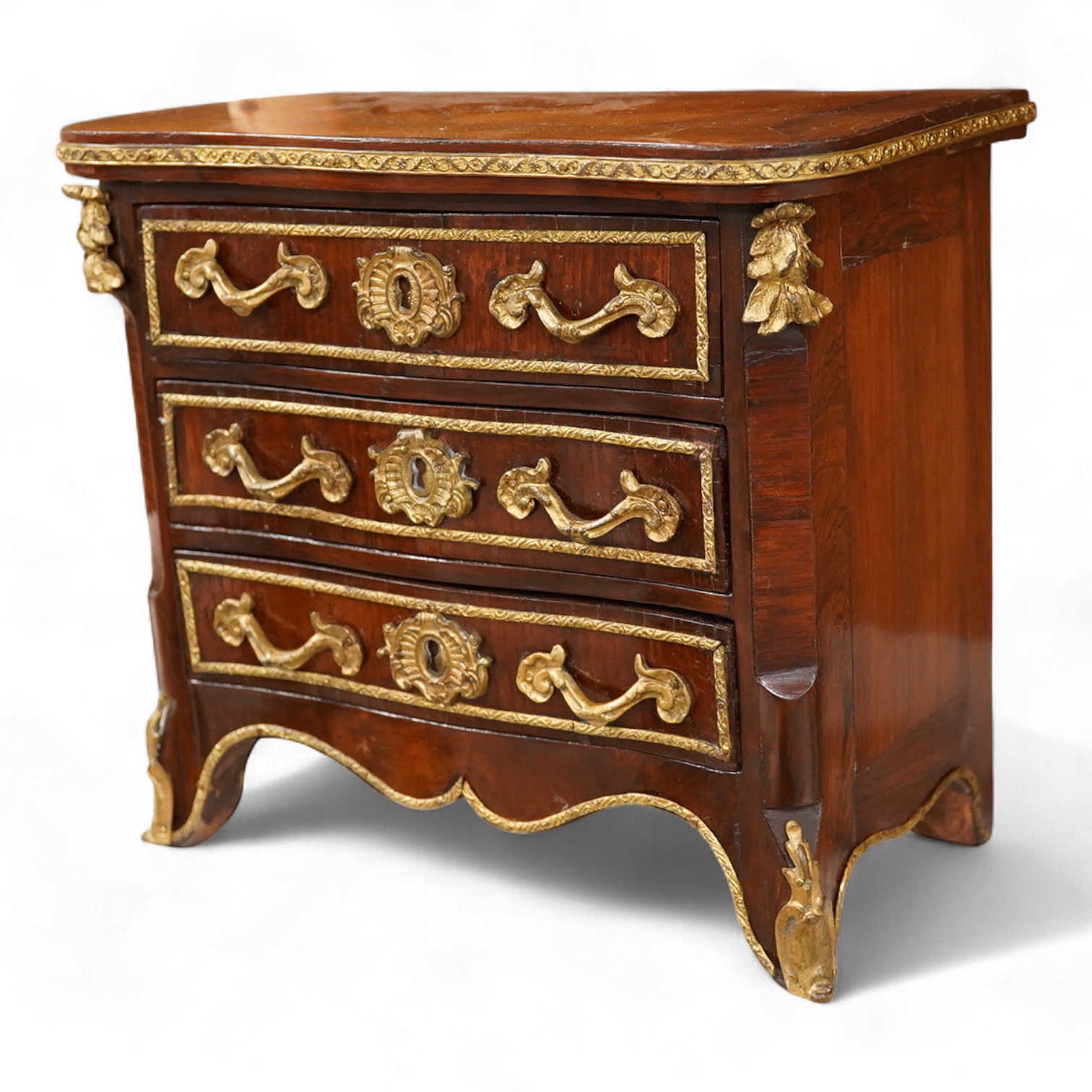 A 19th century French kingwood and gilt metal mounted miniature chest of drawers, 26cm wide x 24cm high